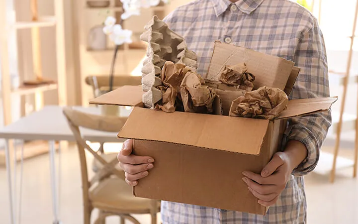 man throwing out wastepaper in paper box man throwing out wastepaper in paper box